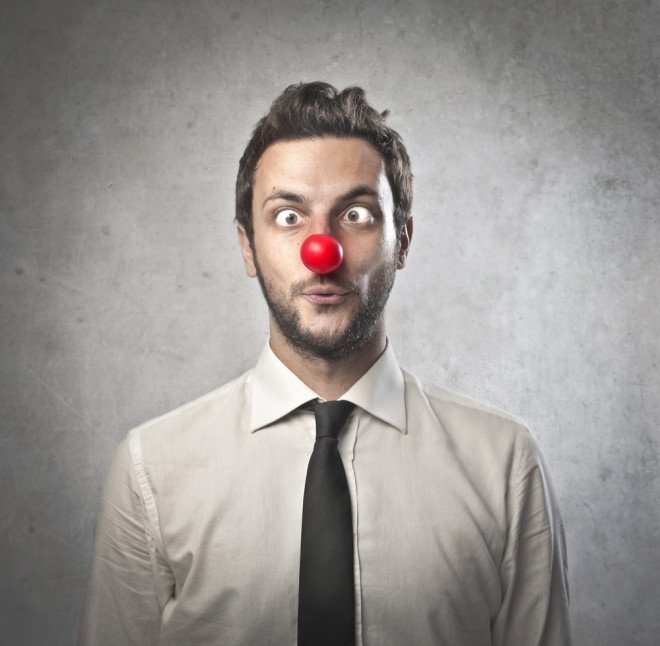 Funny businessman with red plastic nose from shutterstrock.com